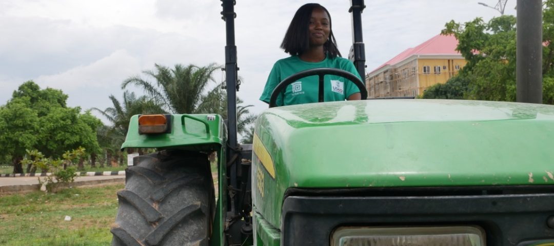 Woman driving a tractor