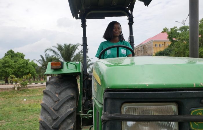 Woman driving a tractor