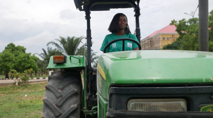 Woman driving a tractor